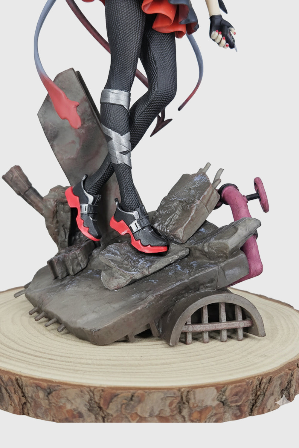 Close-up detail of Arknights Cockroach Girl figure face with red eyes and gray hair