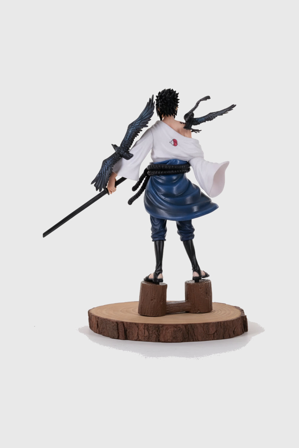 Close-up of Sasuke curse seal tattoo on action figure