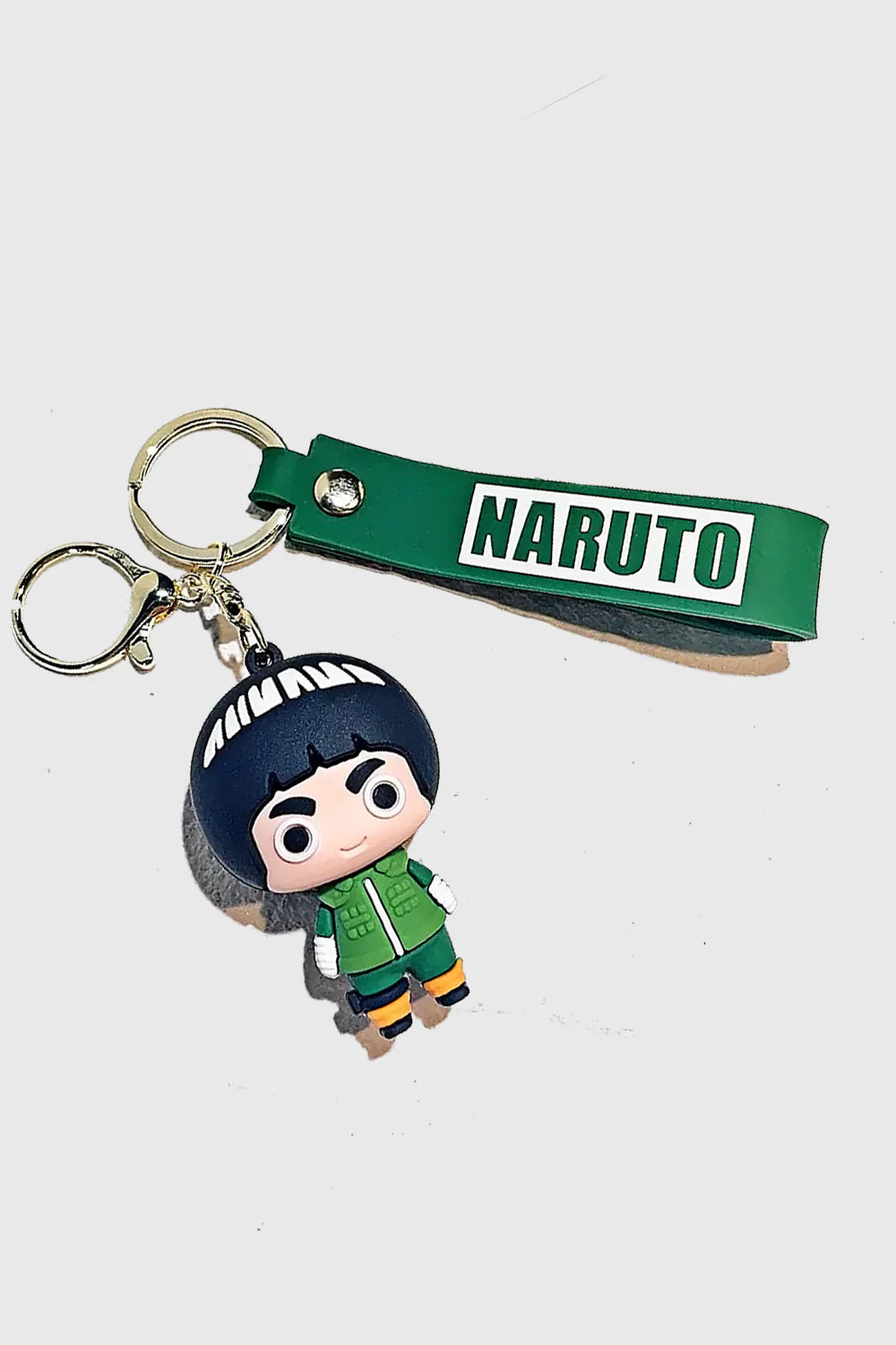 Show your love for Rock Lee with this Naruto-inspired 3D PVC keychain. Made from durable, high-quality PVC, this keychain features Rock Lee in his classic green jumpsuit, along with a matching green "Naruto" wrist strap for added style. Perfect for keys,