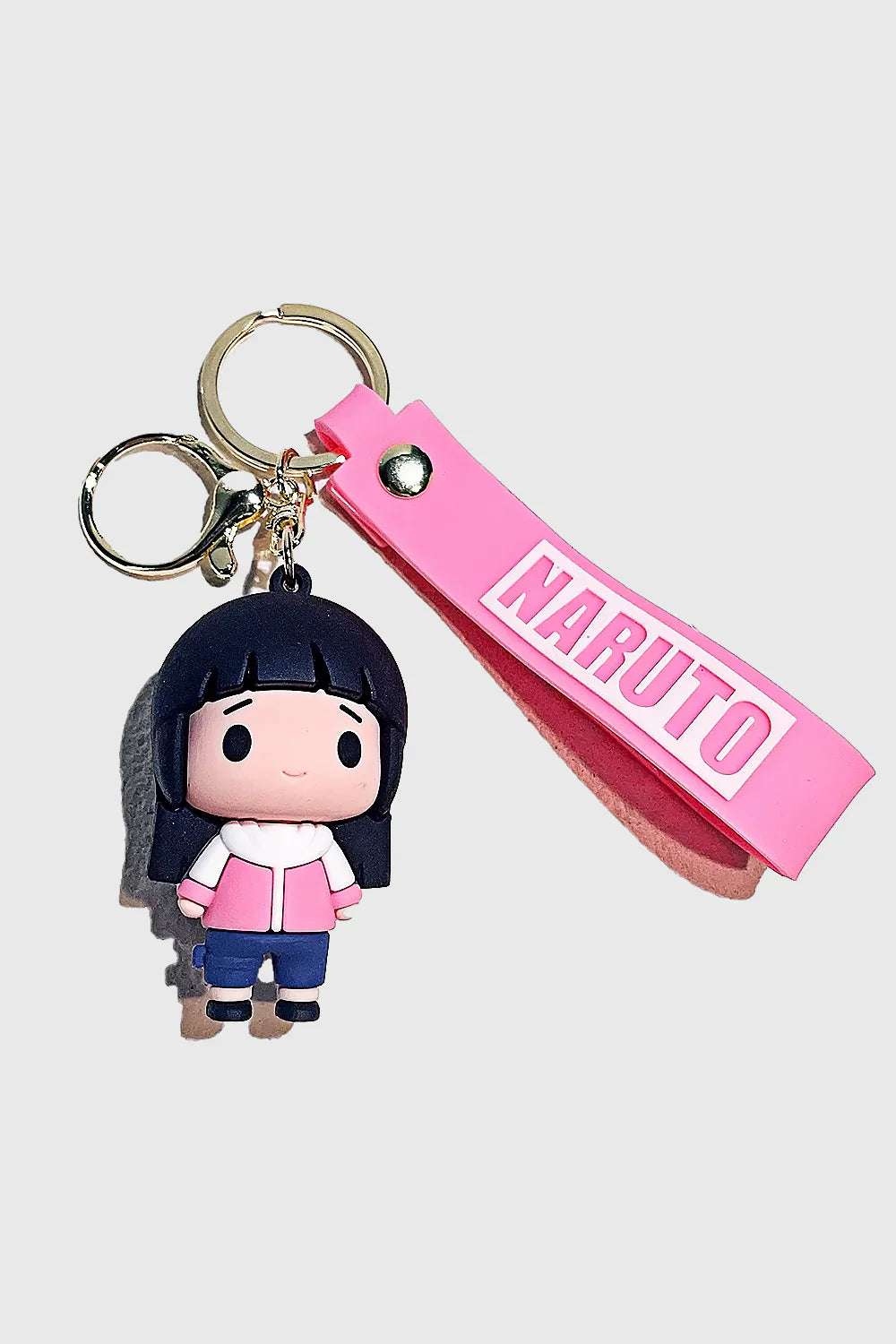 Carry the elegance and strength of Hinata Hyuga with this Naruto-inspired 3D PVC Keychain. Made from high-quality, durable PVC, this chibi-style keyring features Hinata in her signature outfit, along with a matching pink "Naruto" wrist strap for added sty