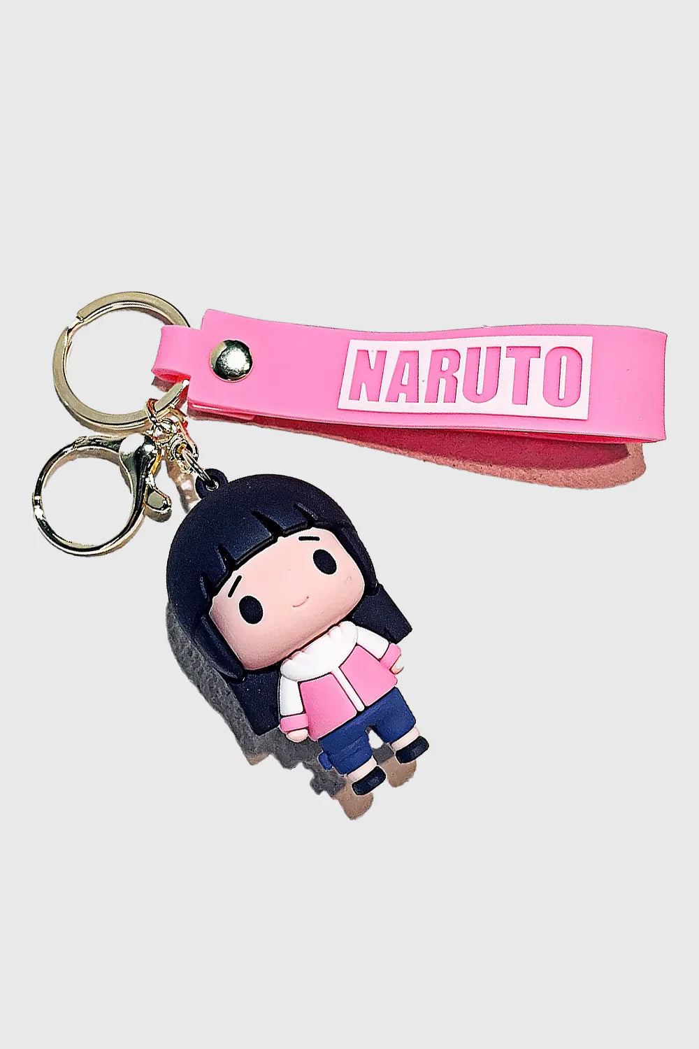 Carry the elegance and strength of Hinata Hyuga with this Naruto-inspired 3D PVC Keychain. Made from high-quality, durable PVC, this chibi-style keyring features Hinata in her signature outfit, along with a matching pink "Naruto" wrist strap for added sty