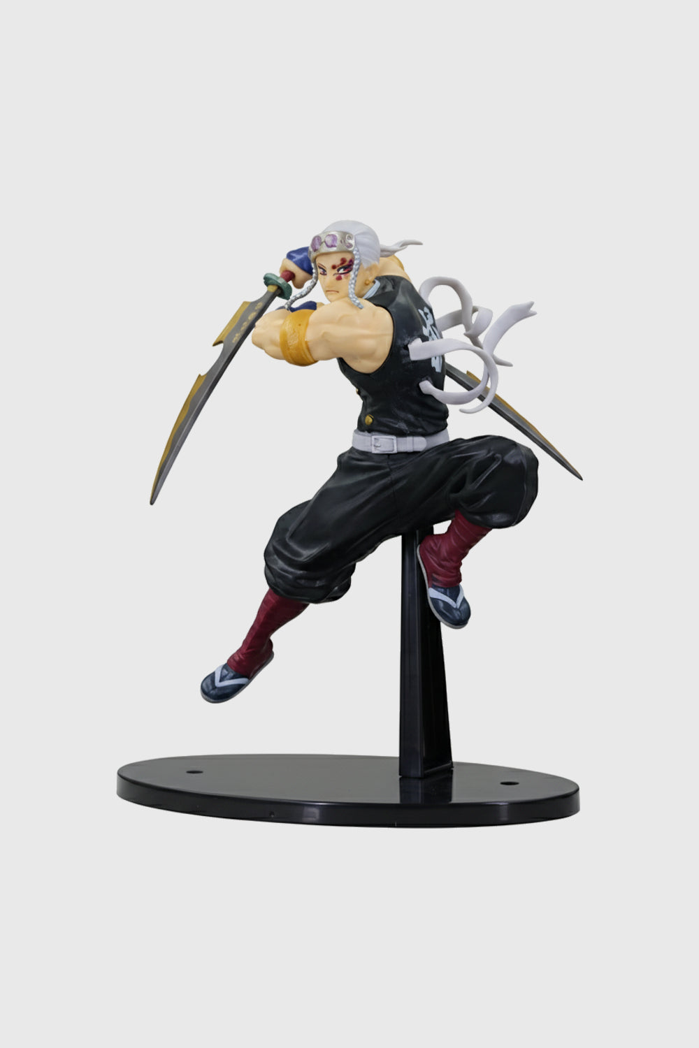 Side view of Tengen Uzui figure in combat stance